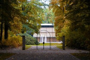 A beautiful garden entrance with a custom gate